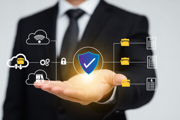 Businessman holding digital shield icon with connected cloud folders, gears, and documents, representing cybersecurity, secure data management, cloud storage, and digital protection. generative ai