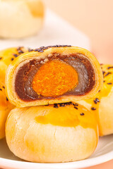 Golden Egg Yolk Mooncake with Red Bean Paste Filling and Black Sesame Seeds