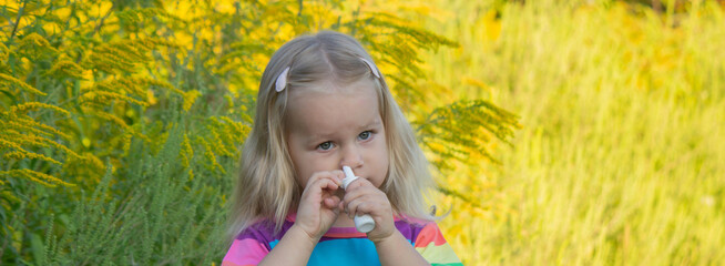 Girl in rainbow shirt with ragweed allergy