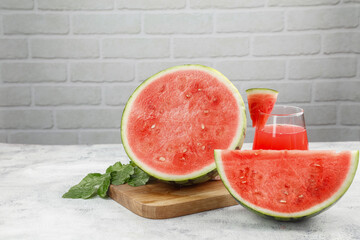 Fresh Red Watermelon Slices with Juice and Mint on Wooden Board