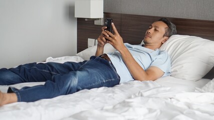 Fototapeta premium young man with mobile phone