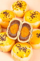 Handmade Golden Glazed Pastries with Chocolate Orange Filling and Black Sesame Seeds