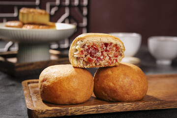 Handmade Mooncakes with Sweet Filling on Wooden Board Traditional Chinese Pastry Baking