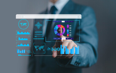 Businessman using futuristic digital dashboard with data analytics, AI technology, and financial statistics for business intelligence, innovation, and corporate growth strategy.
