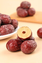 Red Jujube Dates from Xinjiang China - Dried Chinese Fruit on Wooden Background