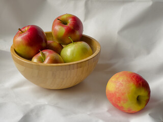 Autumn apples in a wooden bowl