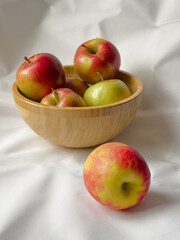 Autumn apples in a wooden bowl