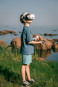Child in 3D glasses escaping reality on sea