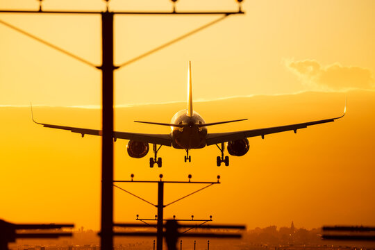 Aircraft close to landing at sunset