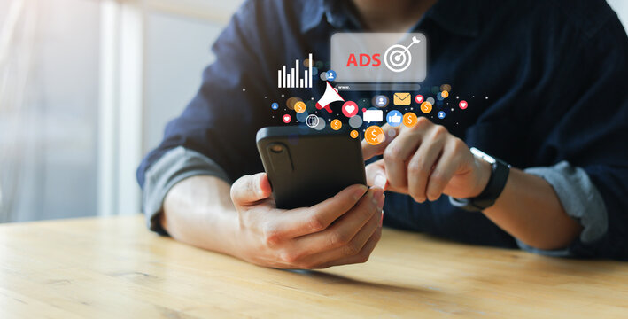 close up man use smartphone to check on virtual dashboard of ads marketing campaign for planning about reach target on website for business technology of search engine concept
