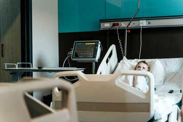 Child Patient Lying in Hospital Therapy Room