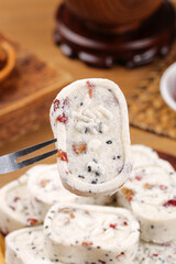 Chinese Rice Cake Slice with Nuts and Dried Fruits - Traditional Asian Dessert Pat Chun Cake