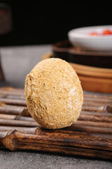 Fresh Coconut with Natural Husk on Wooden Bamboo Mat - Tropical Fruit Close-up