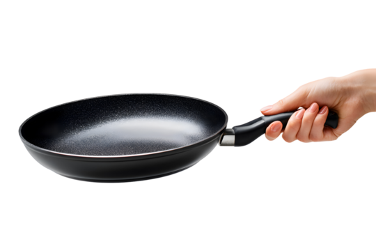 Hand holding a black non stick frying pan isolated on transparent background