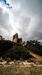 Fototapeta premium Ruined stone tower on a hill