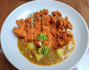 Crispy golden katsu meets rich Japanese curry—comfort food perfection on one plate. Irresistible crunch, savory flavor, and heartwarming taste in every bite