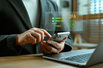 Concept of two-factor authentication and cybersecurity. A person in formal suit uses smartphone for secure login with username and password on virtual screen, emphasizing digital identity protection.