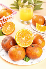 Fresh Orange Citrus Fruits with Juice Glass and Tropical Pineapple on Marble Table for Healthy Breakfast