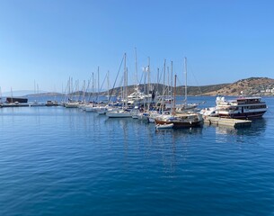 Fototapeta premium Peaceful marina scene with sailboat