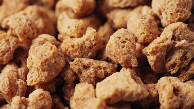 Dried soy meat pieces in a bowl with species. Textured vegetable protein. Healthy eating. Vegan food. High quality 4k footage