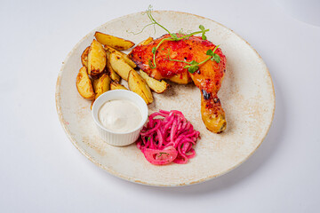 Grilled chicken with crispy potatoes and tangy slaw makes a delightful feast