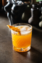 A vibrant cocktail with a fresh citrus flavor sits elegantly, inviting guests to relax and enjoy