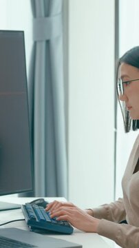 Vertical Screen : Young adult Asia female freelance eyeglasses typing write prompt AI bot app smart program nomad, video game, terminal coding, user interface, designer, big data center on computer.