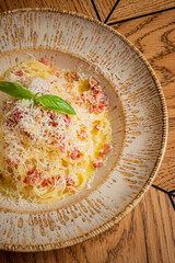 Pasta topped with creamy cheese, herbs, and savory toppings creates a delightful dish