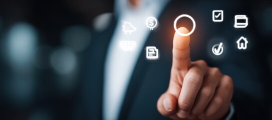 Finger touches a glowing circle on a digital interface surrounded by glowing icons, against a dark, blurred backdrop