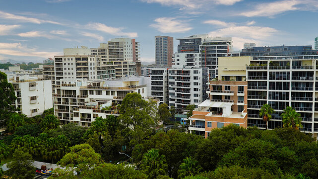 Waterloo Sydney.Urban landscape showcasing modern architecture in a bustling metropolitan area surrounded by greenery throughout the day