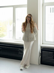 Happy positive elegant woman. Close up portrait of blondie long-haired caucasian woman