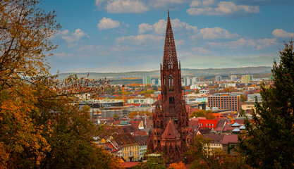 The landscape view of  autumn trees historic buildings at the famous old town of Freiburg im...