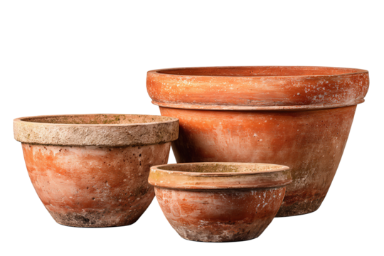 Set of four terracotta planters in varied shapes, tapered, bowl, and wide-rim, arranged offset with warm clay patina, isolated on transparent background.
