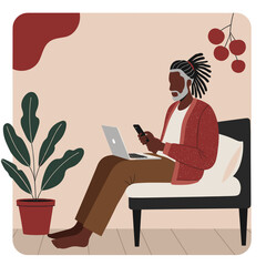 Adult Black man works remotely from home, using laptop and phone in a comfortable, relaxed setting. Modern lifestyle and digital connectivity.