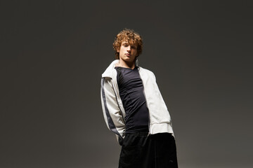 Curly haired dancer expresses artistry and movement in a dynamic studio environment