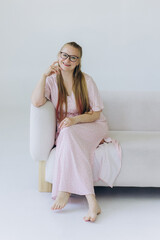 Happy woman smilling at home. Cozy natural portrait of caucasian blondie woman in eye glasses