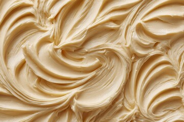 Close up surface of vanilla cream creates abstract lines and waves with soft texture. The detail shows food background patterns for design and creative use.