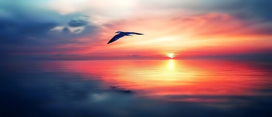 Mirror-like ocean at sunrise with perfect sky reflections and golden hues