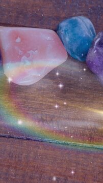 Animation of stars and galaxies moving over stones on wooden surface