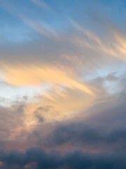 Sunset multicolor dramatic clouds create a peaceful and atmospheric mood