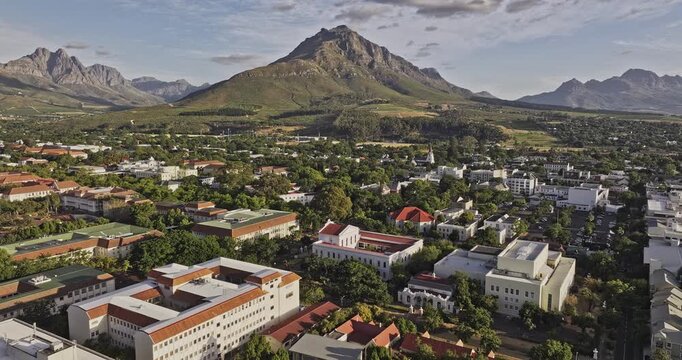 Stellenbosch South Africa Aerial v22 low flyover university campus, capturing a quaint townscape nestled amidst lush greenery and a mountainous landscape - Shot with Mavic 3 Pro Cine - Jan 6th 2024