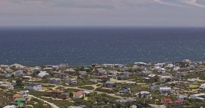 Pringle Bay South Africa Aerial v4 zoomed flyover capturing residential neighborhood in a rural coastal village located in Western Cape's Overberg region - Shot with Mavic 3 Pro Cine - Jan 9th 2024