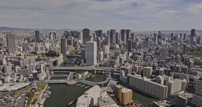Osaka Japan Aerial v33 flyover Kawaguchi along Tosahori river capturing government and commercial offices on Nakanoshima Island and downtown cityscape views - Shot with Mavic 3 Pro Cine - Oct 9th 2023