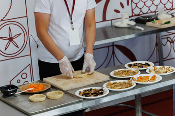 Culinary Preparation A Chef at Work with Various Ingredients and Utensils in Action