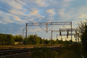 Fototapeta premium Railway Power Lines and Signals at Sunset