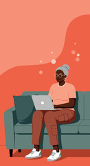 Mature African American woman comfortably using a laptop on a sofa. Represents remote work, online learning, digital literacy, and modern senior lifestyle.
