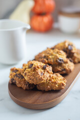 pumpkin chocolate chip cookies on a table