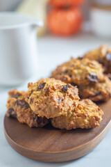 pumpkin chocolate chip cookies on a table