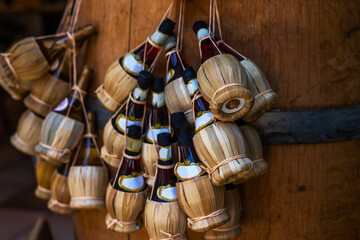 Traditional food and wine shop. San Gimignano, Toscana. Shop with traditional cheese, ham and wine.Small wine bottles for sale in a souvenir shop in Italy, typical Italian souvenir.
