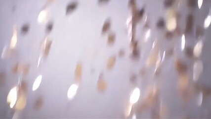 Beautiful sparkling rose gold confetti falling down in slow motion against a light background. - Powered by Adobe